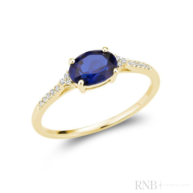 Bague en pierre ovale colorée et diamant