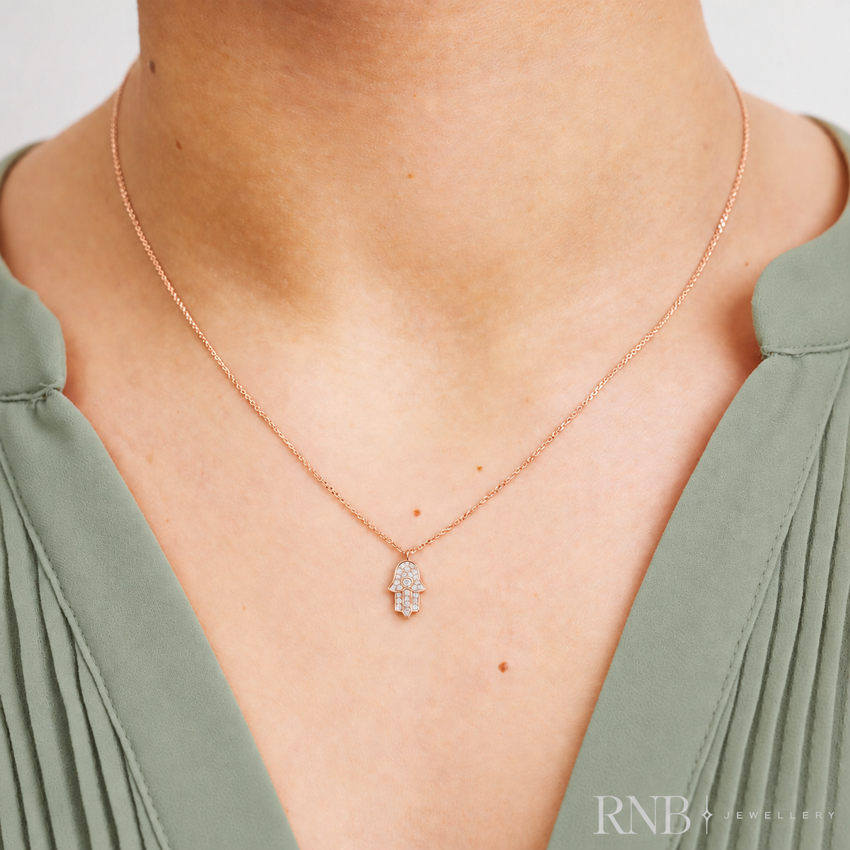 09-04HAMSAR - Rose Gold Hamsa Diamond Pendant worn with sage green top